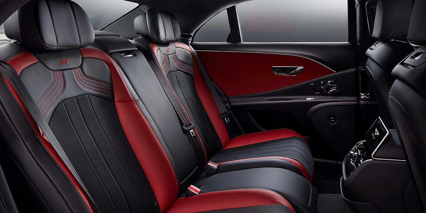 Bentley Geneve Bentley Flying Spur S sedan rear interior in Beluga black and Hotspur red hide with S stitching