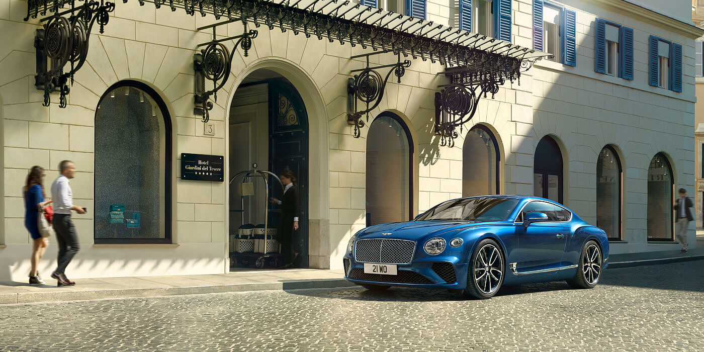BENTLEY-CONTINENTAL-GT-IN-SEQUIN-BLUE-PAINT-PARKED-ON-CITY-STREET-ITALY