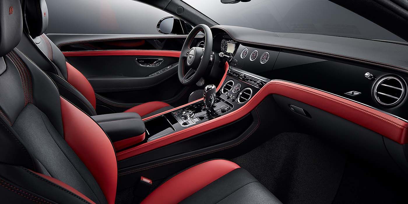Bentley Geneve Bentley Continental GT S coupe front interior in Beluga black and Hotspur red hide with high gloss Carbon Fibre veneer