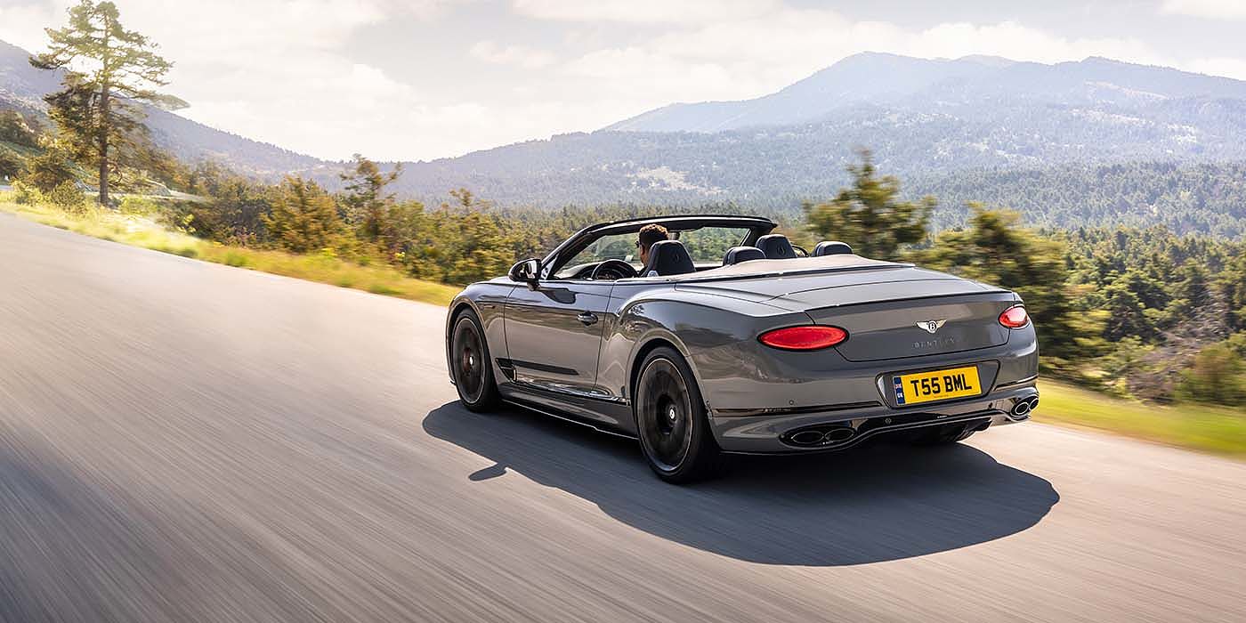 Bentley Geneve Bentley Continental GTC S convertible in Cambrian Grey paint rear 34 dynamic driving