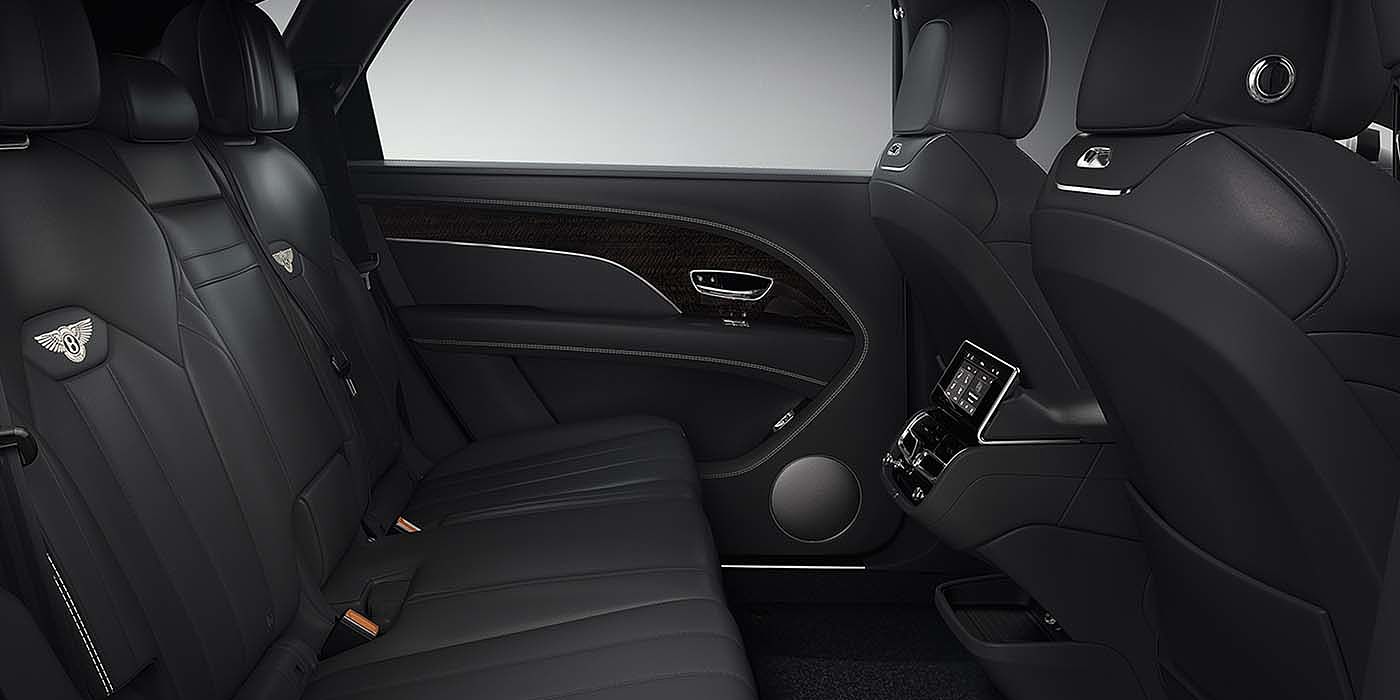 Bentley Geneve Bentley Bentayga EWB SUV rear interior in Beluga black leather