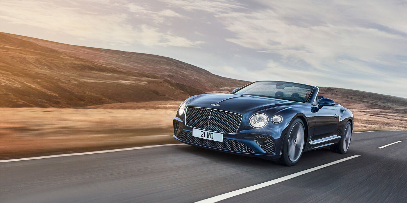 Bentley Geneve Bentley Continental GTC Speed convertible in Peacock paint side front 34 dynamic