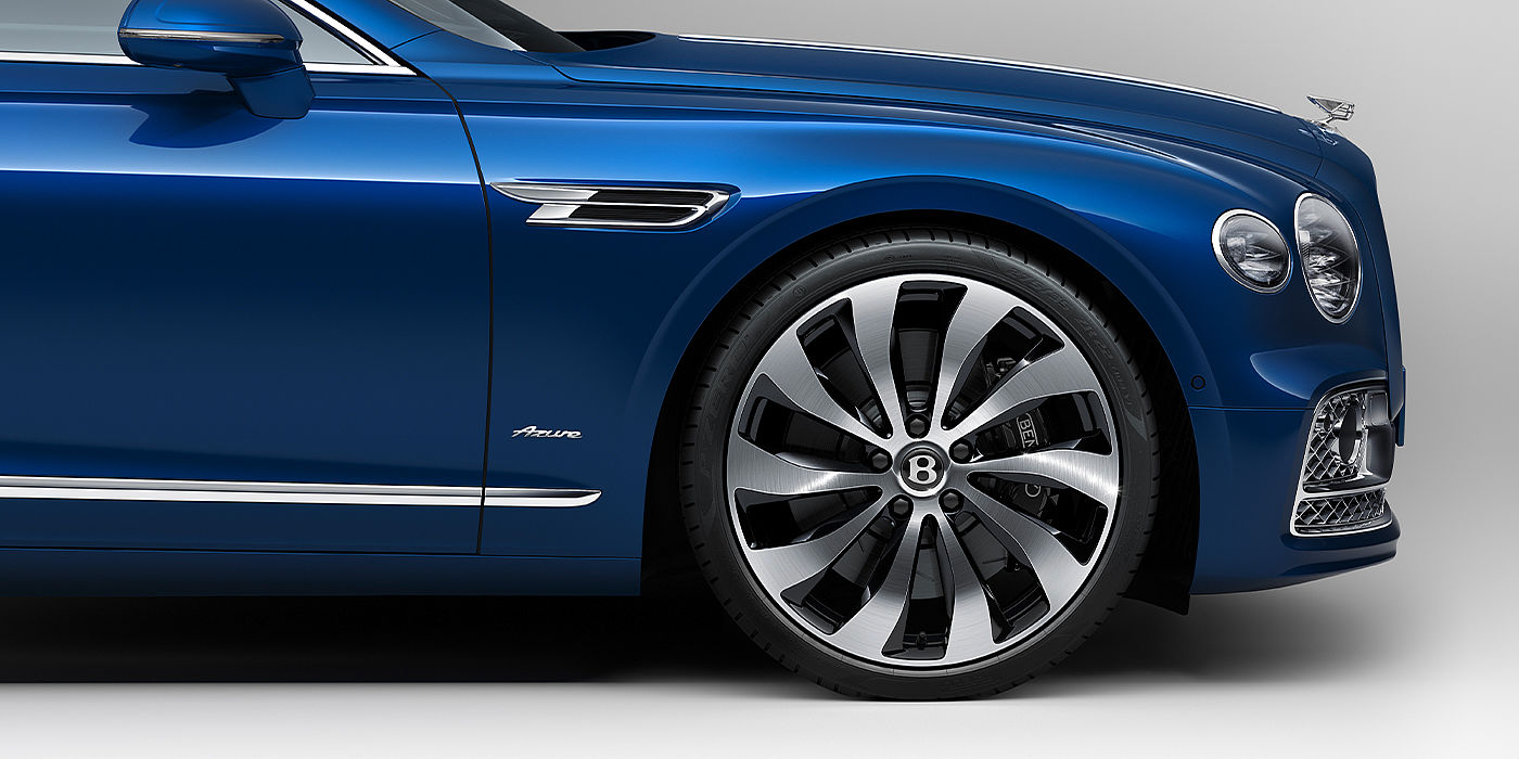 Bentley Geneve Bentley Flying Spur Azure sedan side close up in Sequin Blue paint with Azure badge