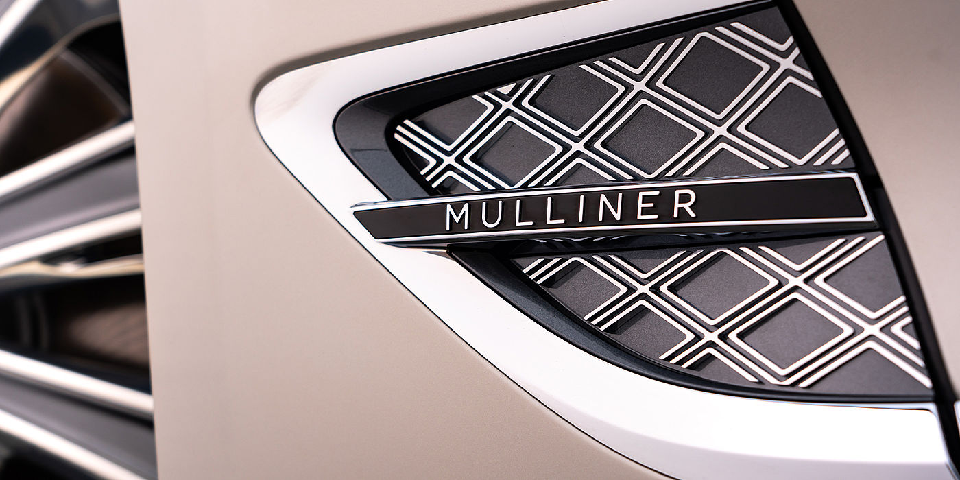 Bentley Geneve Bentley Continental GT Mulliner coupe in White Sand paint Mulliner wing vent close up
